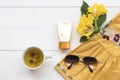 Sunscreen ,sunglasses ,herbal healthy drink and yellow embroider cloth of lifestyle woman relax summer