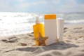 Sunscreens on the beach near the sea close up Royalty Free Stock Photo