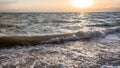 Sunsdown and surf at Dead Sea in winter dusk Royalty Free Stock Photo