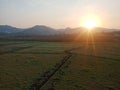 Sunsen behind the mountain in the countryside of Indonesia Royalty Free Stock Photo