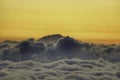 Sunset above the clouds Mount Meru