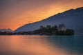 Sunset above Iseltwald peninsula and former castle in Switzerland Royalty Free Stock Photo