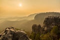 Sunset above sandstone towers in Saxon-Bohemian sandstone region, Bohemian Switzerland, Czech republic, Europe Royalty Free Stock Photo