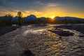 Sunset above stream in the forest of Grand Teton Mountains in Wyoming Royalty Free Stock Photo