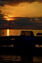 Sunset above Vrsi Mulo beach in Croatia, Adriatic with silhouette of boats and molos Royalty Free Stock Photo