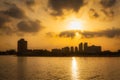 Sunset in Abu Dhabi with skyscrapers silhouetted over the Persian Gulf, UAE Royalty Free Stock Photo