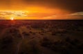 Sunset, aerial, atmospheric view on curving sandy path, Moremi forest, Botswana. Typical ecosystem, part of Okavango delta, aerial Royalty Free Stock Photo