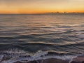 Sunset aerial view of the on the sea in the golden hour and clouds parade on the horizon Royalty Free Stock Photo