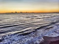 Sunset aerial view of the on the sea in the golden hour and clouds parade on the horizon Royalty Free Stock Photo