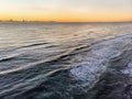 Sunset aerial view of the on the sea in the golden hour and clouds parade on the horizon Royalty Free Stock Photo