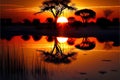 Sunset in the African savannah with a tree reflected in the water Royalty Free Stock Photo