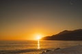 Sunset along Amalfi Coast. Airplane vapor trail Royalty Free Stock Photo