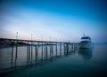 Sunset along a wooden pier at magic hour Royalty Free Stock Photo