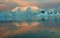 Sunset and alpenglow, mountains and mirror - calm ocean