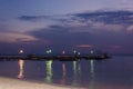 Sunset with anchored sail boats on sea by the bay