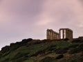 Sunset at ancient ruins of Poseidon temple. Royalty Free Stock Photo