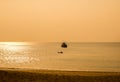 Sunset by The Andaman Sea. Fishing boats pull their nets Royalty Free Stock Photo