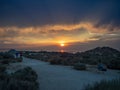 Sunset on the Antelope Island on the great Salt Lake outside the City, colorful orange dusk above a road with buffalos panorama ba