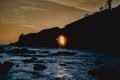 sunset through arched rock at Lapush, Ruby Beach, Washington Royalty Free Stock Photo