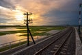 Sunset area of Railroad tracks with floating railway bridge over water reservoir at Pa Sak Cholasit Dam, Lopburi, Thailand Royalty Free Stock Photo