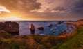 Sunset Arnia Beach (Spain, Atlantic Ocean) coastline landscape Royalty Free Stock Photo