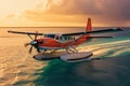 Sunset arrival Seaplane landing on Maldives sea, luxury travel scene Royalty Free Stock Photo