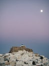 Sunset in Astypalaia with the full moon above the castle