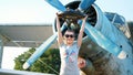 at sunset, athletic, young woman in sunglasses, in tights, doing exercises with weight, heavy weight plate, on an Royalty Free Stock Photo