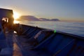 Sunset on the Atlantic ocean taken from the cargo container ship from forward manoeuvring station. Royalty Free Stock Photo