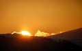 Sunset in the austrian alps with silhouette of colorful clouds and mountains in the austrian alps in styria Royalty Free Stock Photo