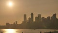 Sunset on the background of Mumbai skyscrapers. View from Chowpatty Beach. Royalty Free Stock Photo