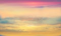 Sunset background,sun on blue  sky ,sunlight at sea, fluffy clouds on skyline ,nature pink yellow blue pastel color   nature Royalty Free Stock Photo