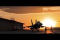 sunset backlit view of military fighter jet pilot beside parked military airforce plane next to barracks or hangar as wide banner