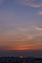 Sunset in Bangkok, Thailand, silhouette of big building in city with dramatic vanilla sky