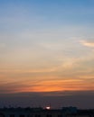 Sunset in Bangkok, Thailand, silhouette of big building in city with dramatic vanilla sky