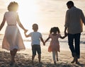 Sunset, beach and back of family holding hands in nature for travel, bond and fun together. Rear view, love and children Royalty Free Stock Photo