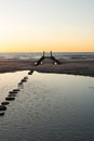 Sunset at the beach, blue hour, breakwaters