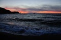 Sunset on the beach with boat, Giglio Island, Tuscany Italy