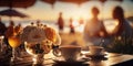 sunset beach cafe ,cup of coffee ,glass of wine,weet cake and flowers on table ,romantic couple relaxing, Royalty Free Stock Photo