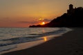 Sunset on the beach and a castle Royalty Free Stock Photo