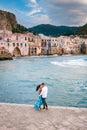 Sunset at the beach of Cefalu Sicily, old town of Cefalu Sicilia panoramic view at the colorful village Royalty Free Stock Photo