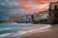 Sunset at the beach of Cefalu Sicily, old town of Cefalu Sicilia panoramic view at the colorful village Royalty Free Stock Photo