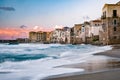 Sunset at the beach of Cefalu Sicily, old town of Cefalu Sicilia panoramic view at the colorful village Royalty Free Stock Photo