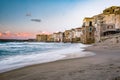 Sunset at the beach of Cefalu Sicily, old town of Cefalu Sicilia panoramic view at the colorful village Royalty Free Stock Photo