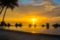 Sunset, beach chairs, palm trees, infinity swimming pool silhouette. Maldives Royalty Free Stock Photo