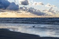 Sunset on the beach with cloudy sky, Baltic sea, Jurmala, Latvia Royalty Free Stock Photo