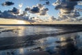 Sunset on the beach with cloudy sky, Baltic sea, Jurmala, Latvia Royalty Free Stock Photo