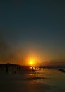 The sunset on the beach creates a beautiful silhouette on the Lombang beach in Sumenep