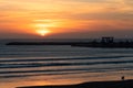 Sunset on the Beach in Essaouira Morocco near the Horizon with Waves and the Shipyard Royalty Free Stock Photo