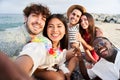 Sunset beach - Group of five cheerful young friends taking selfie portrait. Happy people looking at the camera Royalty Free Stock Photo